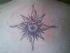 my wifes sun on her back tattoo