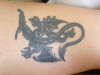 Dragon in left leg tattoo