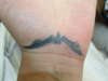 Vamp in left hand tattoo