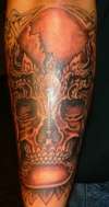 Carlos skull tattoo