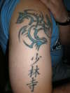 dragons heads and lettering tattoo