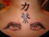 Kanji and eyes tattoo