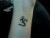AUM symbol tattoo