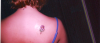 pink daisy tattoo
