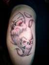 elbow skulls tattoo