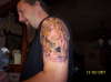angel holding Dimebags guitar tattoo