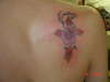 Cross/Hibiscus flower tattoo