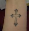 Cross on wrist tattoo