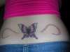 butterfly with rainbow confetti tattoo