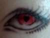 Fire eye, heart shaped pupil tattoo