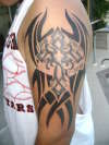 cross with tribal tattoo