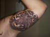 dragon with smoke background underside of my arm tattoo