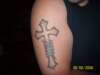 Cross with 5 of my kids names in banners wrapped around cross tattoo