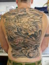 ginger monkey- dragon full back tattoo