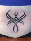 Tribal...  lower back tattoo