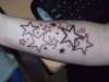 lower arm stars tattoo