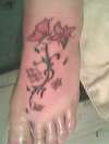 butterfly and floral foot tattoo