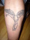 Bald angel tattoo