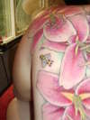 close up lilly and bee tattoo