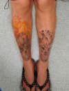 burning skulls on legs (unfinished) tattoo