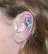 Flower in an Ear tattoo