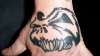 skull on hand tattoo