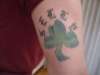 clover with last name tattoo
