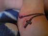 rosary beads around ankle/foot tattoo