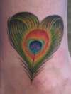 Peacock feather heart tattoo