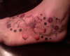 Flowers on the foot tattoo