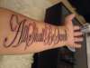 religious script tattoo