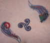 Triskele and decoration tattoo