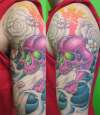 pink skull sleeve tattoo