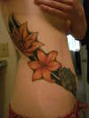 Flower side piece tattoo