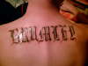My last name across my shoulder blades tattoo