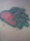 f'd up heart w/ roses tattoo