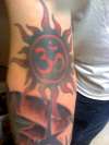 OM Sun tattoo