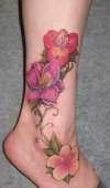 Peruvian lily, lily and hibiscus tattoo