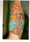 inside arm tiki half sleeve tattoo