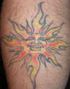 Sun/Flash tattoo