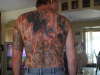 whole back collage tattoo