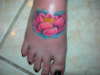 lotus flower on foot tattoo