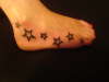 Stars on foot tattoo