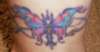 butterfly rap around tattoo