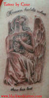 Angel statue tattoo