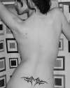 lower back tat tattoo