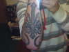 Cross forearm tattoo