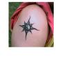 Yin Yang starburst tattoo
