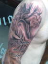 Top of sleeve tattoo