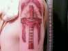 rip cross tattoo